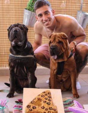 Konstantinos Tsimikas with his dogs Maui and Fuerte.